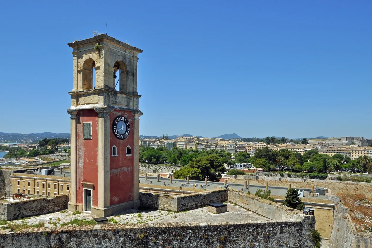 The clock tower of the Old Fortress, with Corfu Town beyond